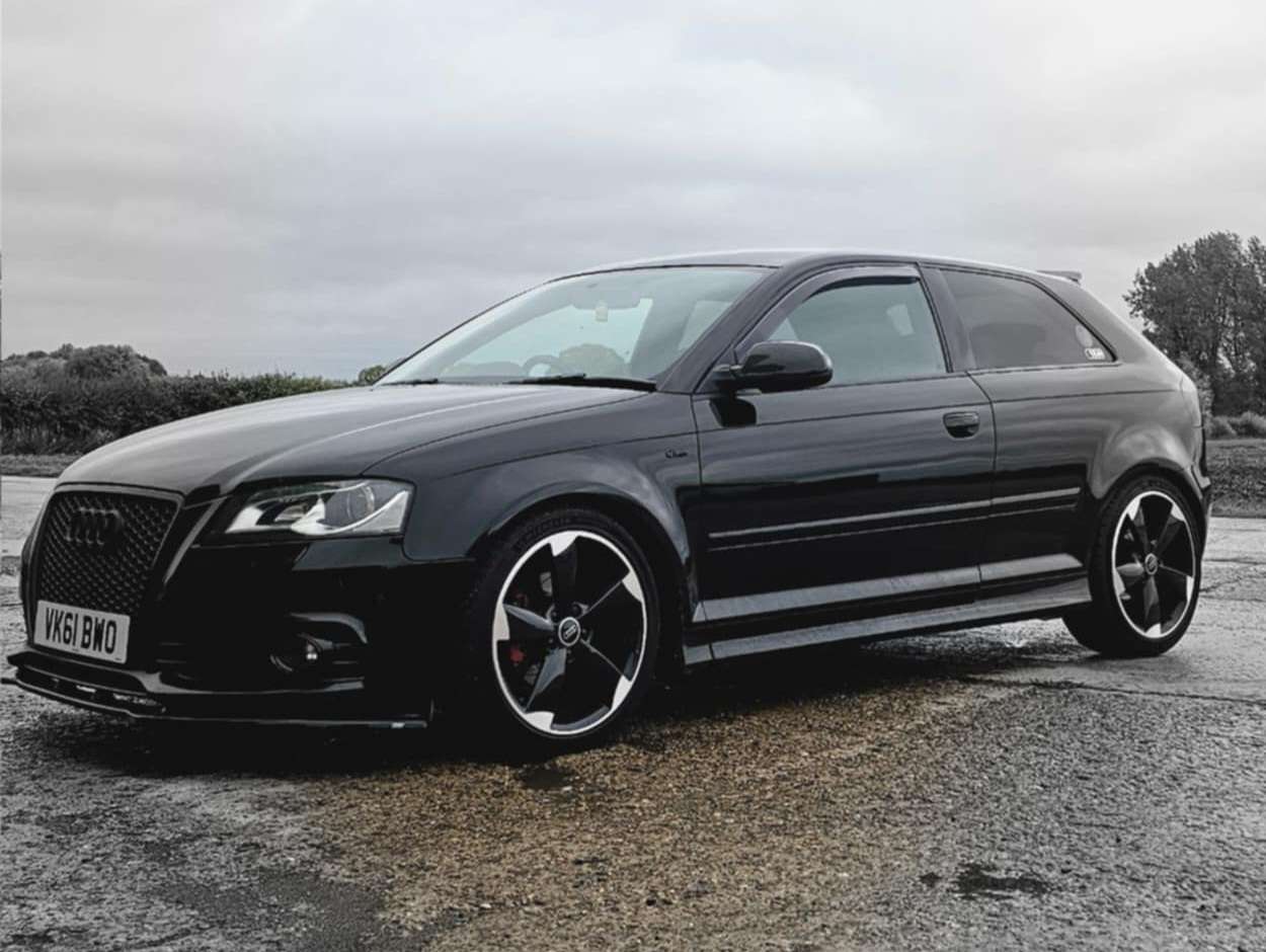 Classic cars parked at a meet in Oxfordshire at sunset